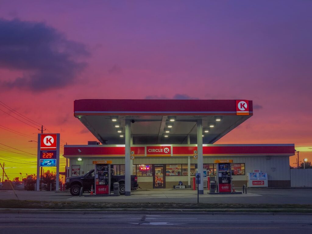 A pickup truck refueling at a Circle K convenience store.
